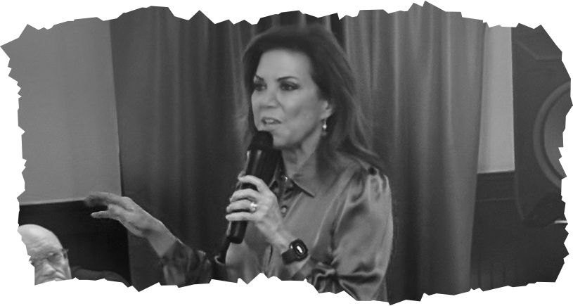 Michele Tafoya speaking into a microphone